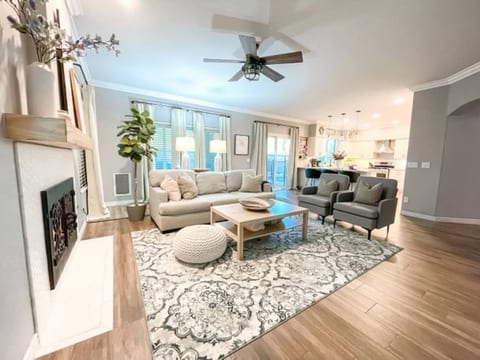 Perfect gathering area for games, shows, and laughs in this warm and cozy family room with gas fireplace and 65” HDTV that flows into the open-concept chef’s kitchen for entertaining your family and friends. 