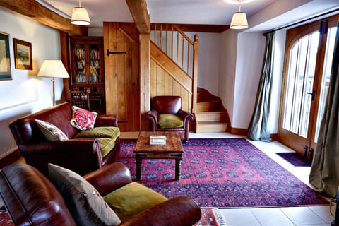 Living room with double doors leading to terrace