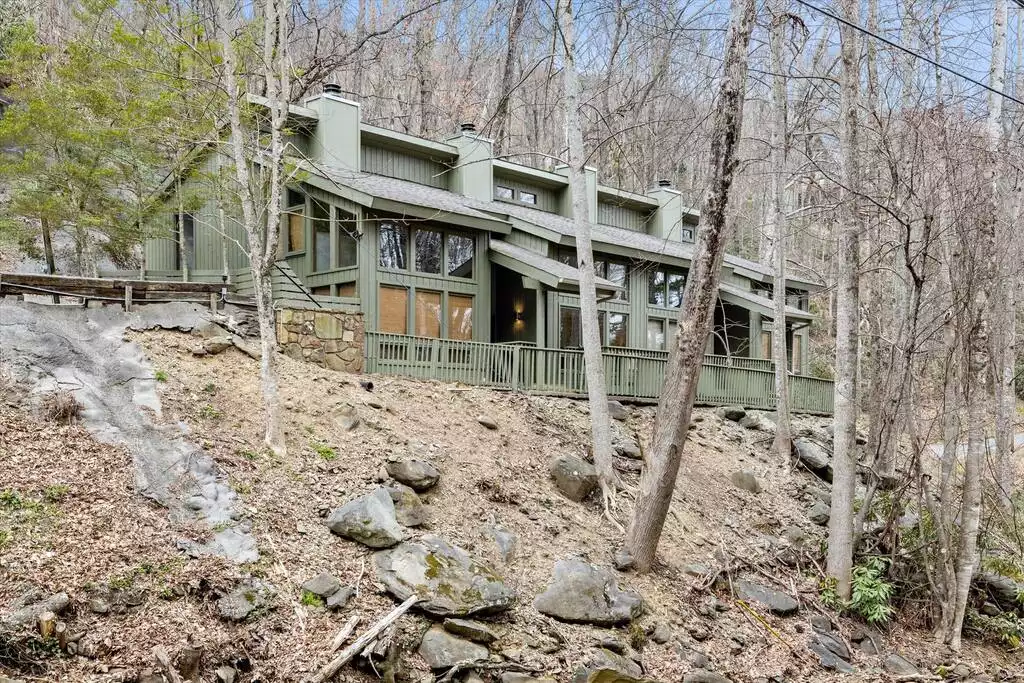 The condo sits above the rushing waters of Buckberry Creek down below.