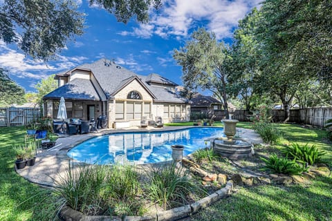 Relax in your private backyard oasis with a sparkling pool.