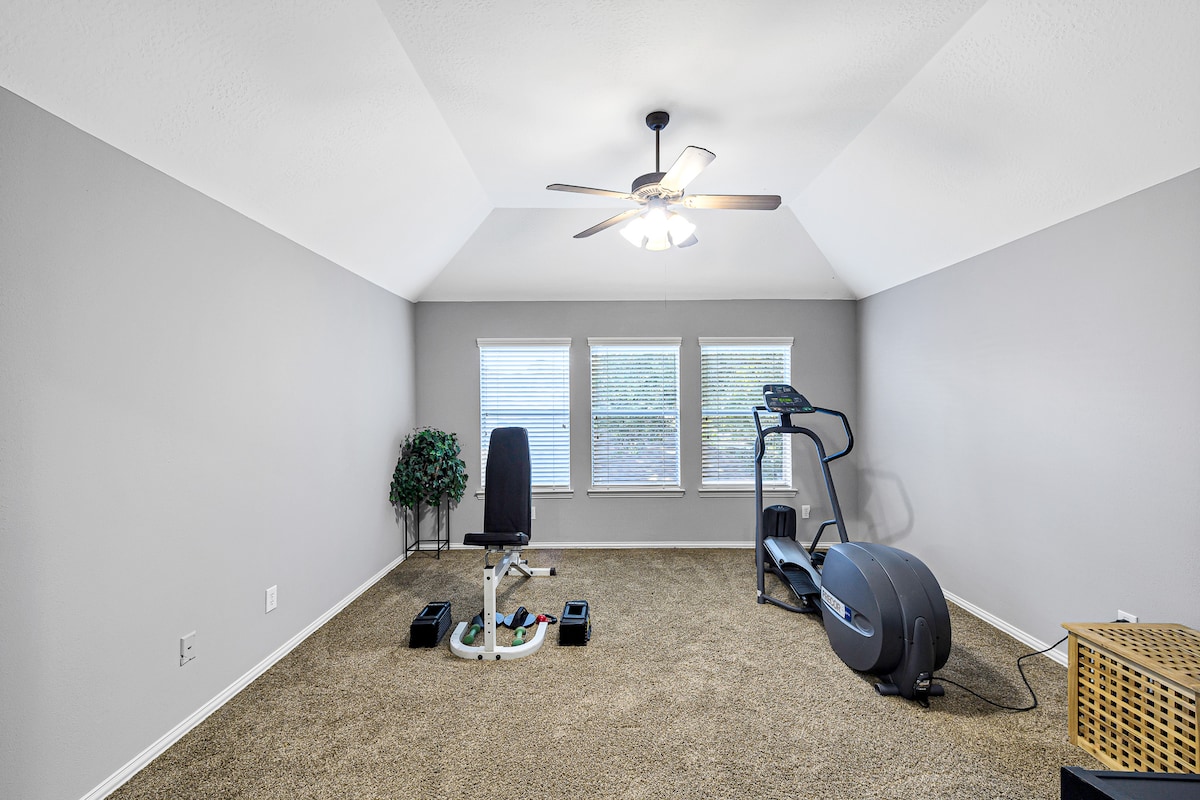 Stay active with a private gym featuring cardio and weight equipment.