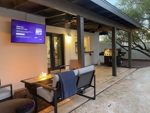 Outdoor TV with gas fire pit.