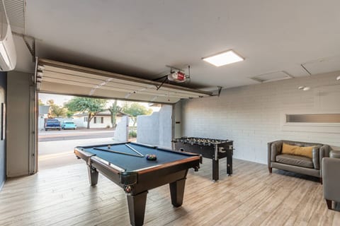 [Game room] Pool, foosball tables and seating.