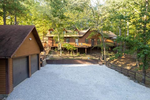 Large lower parking area has lighted stair access to front wrap around deck and both entrances. 