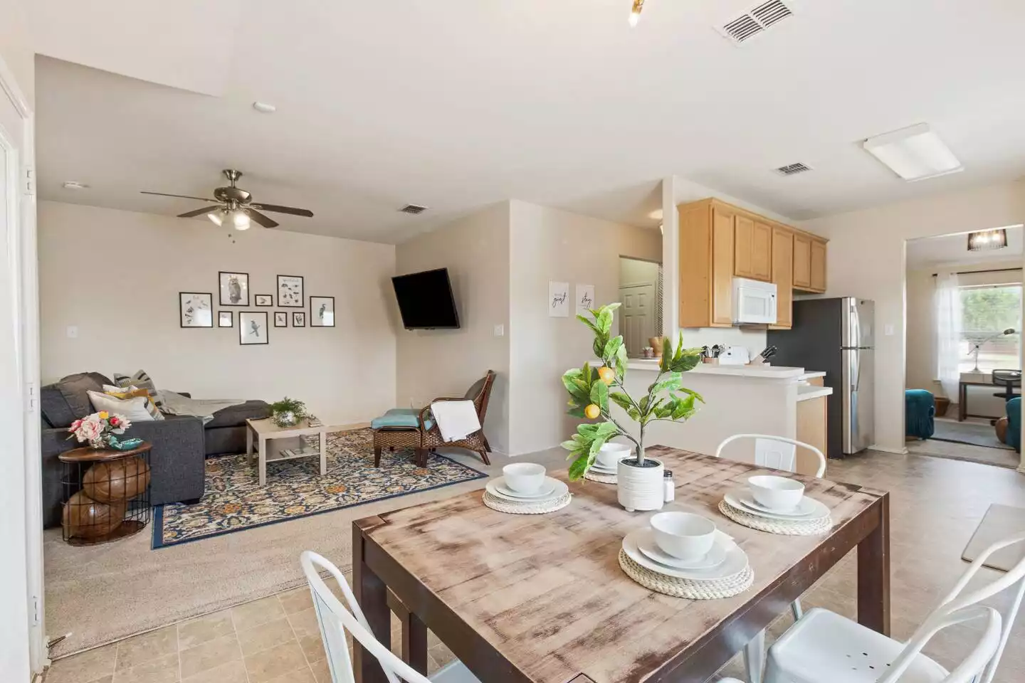 An open concept living and dining area for a large and welcoming family atmosphere. An open concept living and dining area for a large and welcoming family atmosphere. - The Birdhouse - Keller