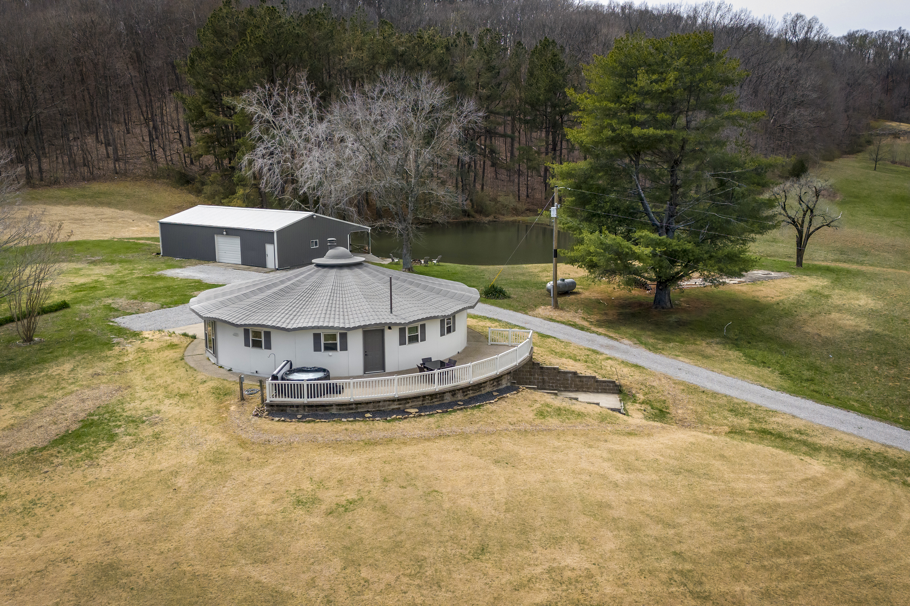 Aerial photo of property with pond