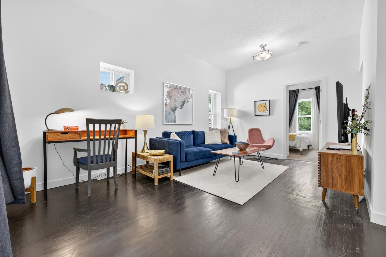Bright and spacious living room perfect for relaxing after a day in Edmonton. Comfortable seating makes it a cozy spot to unwind.