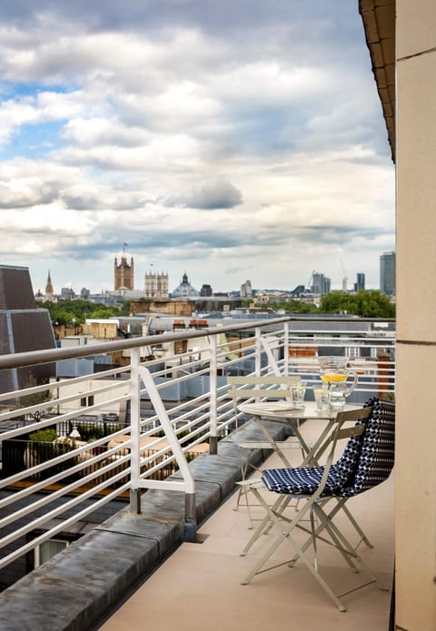 Elegant 4-Bed Apartment with Balcony & View