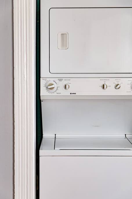 The laundry space features a washer and dryer for your convenience, ensuring you can keep your wardrobe fresh throughout your stay.