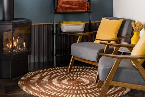 The perfect spot to sip tea or wine by the fire. This cozy corner was made for unplugging and recharging.
