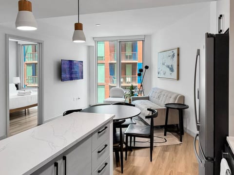Open kitchen, dining, and living area with a bright, cozy feel.