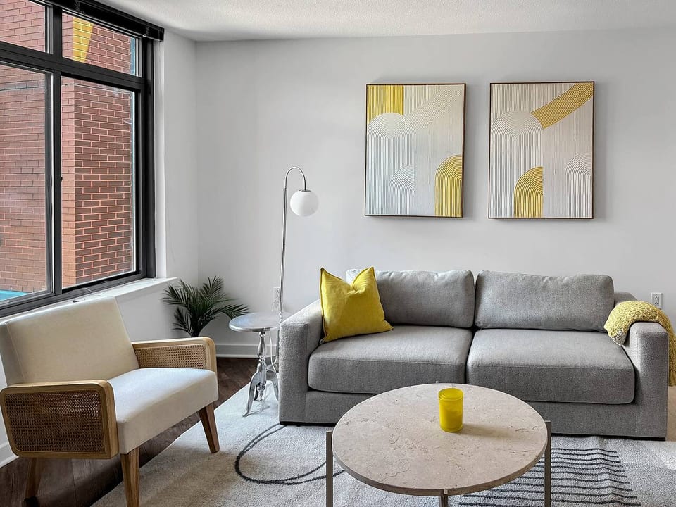 Modern living room with bright accents and natural light.