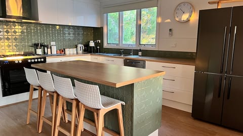 Our brand new kitchen features a 900mm electric stove/gas cooktop, 5 stage water filter, giant fridge with ice maker, cold water dispenser and Miele dishwasher. Add in breadmaker, toastie machine, rice cooker, brilliant knives and you're all set!