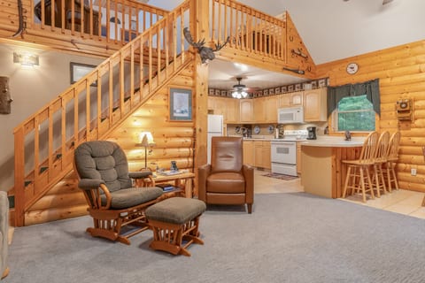 Cozy log cabin living with loft, full kitchen, and rustic charm