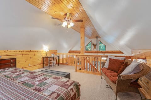 Master loft includes a dedicated work desk with natural light, perfect for remote work or writing. Stay productive while enjoying the cozy cabin atmosphere.