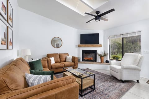 Comfy living room for you to relax and watch TV, or turn on the fireplace!