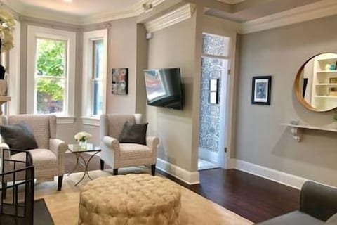 Enter into a warm, welcoming living space with thoughtful design, natural light, and timeless comfort waiting just beyond the front door.