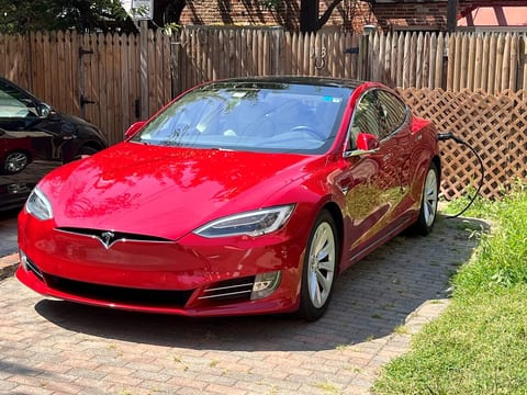 Guest using complimentary EV ChargePoint station and parking for Tesla Model S.Rear Parking Space, Back of House (21’ long x 10’ wide).