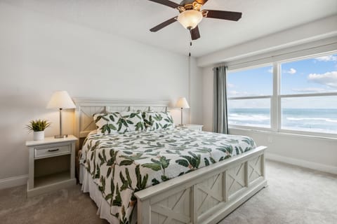 Master bedroom with king bed and ocean view.