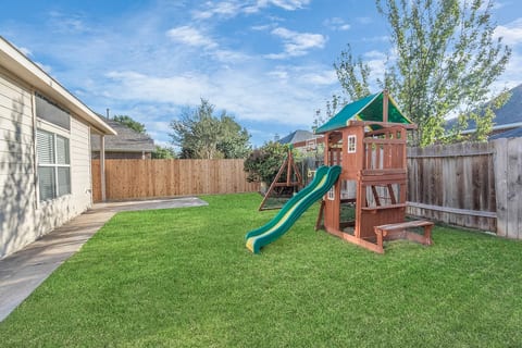 Outdoor fun awaits! Explore the playground and enjoy a spacious side yard for soccer and pet playtime.