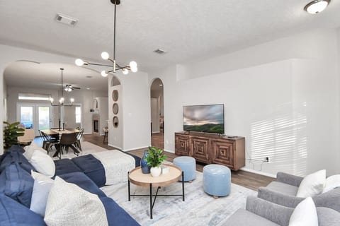 Your home away from home— designed for comfort, connection, and relaxation. Bright open spacious living with modern decor, smart TV, high-speed WiFi, and plenty of seating. Perfect for relaxing, working remote, or enjoying mid-term stays in comfort.