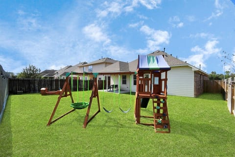 The spacious backyard backs up to no neighbors, so you can enjoy privacy while your kids play on the playground or get a friendly game of tag going.