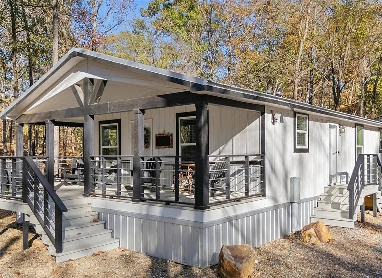 Welcome to your forest hideaway ✨
Relax on the spacious covered porch with cozy seating and peaceful woodland views — the perfect place to unwind