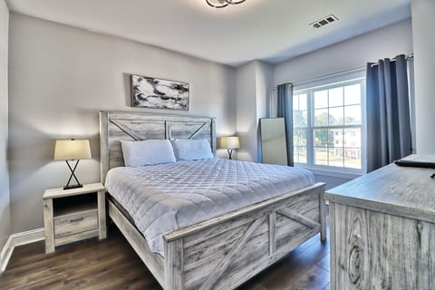 Primary bedroom with one king bed