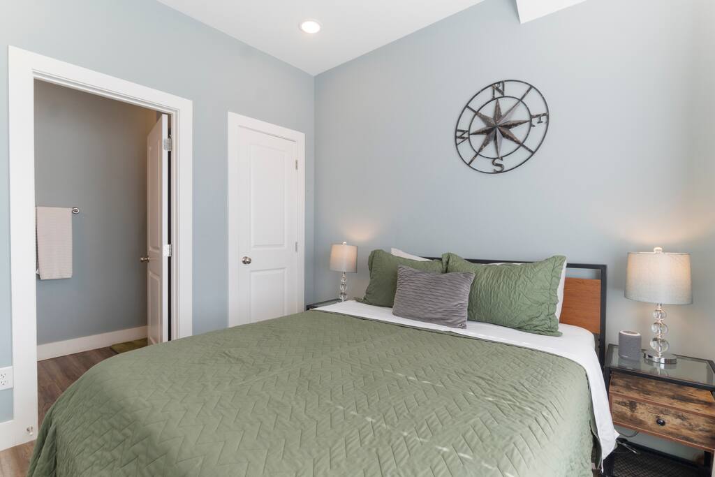 First-floor (entry level) bedroom featuring a queen-sized bed and private ensuite bathroom for added comfort and convenience