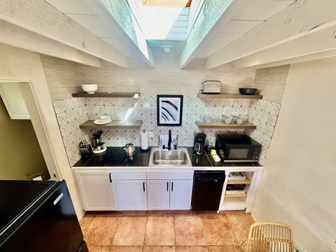 Kitchenette: cooktop, sink, dishwasher, microwave