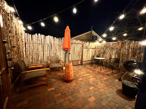 Private patio with seating and dining areas. Plus, a lovely chiminea.