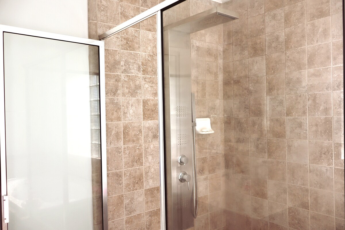 A close up of the multi-shower modes, shower panel.