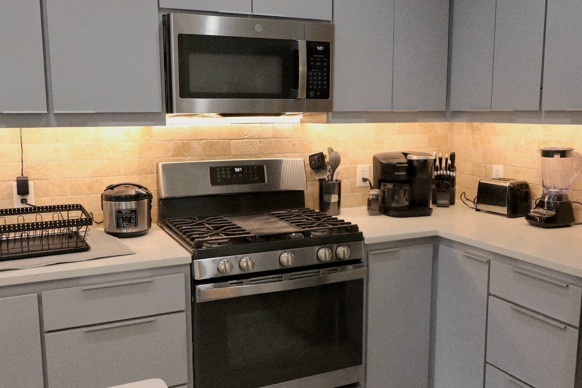 Full service kitchen includes, gas stove, microwave, dish washer, garbage disposal, rice cooker, coffee maker, toaster, blender and all the necessary cooking supplies too make a full meal.