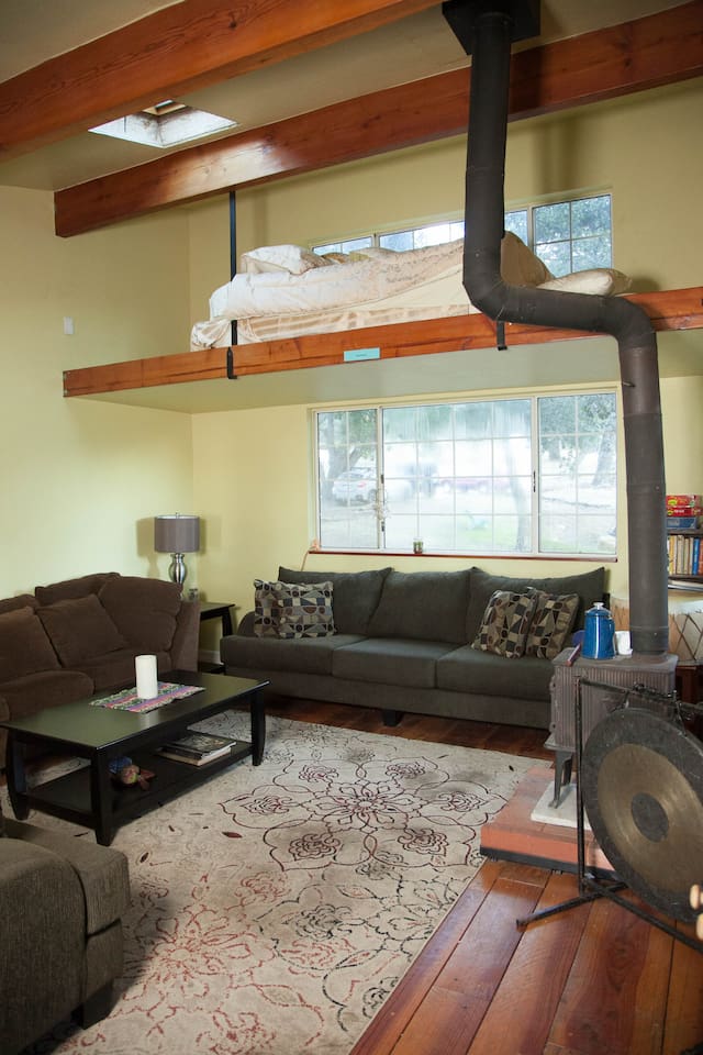 Loft with queen size bed above living room
