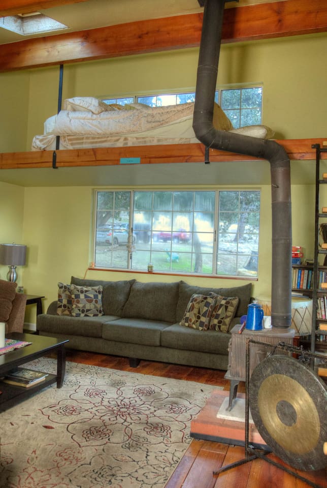 Living room with another queen bed in loft