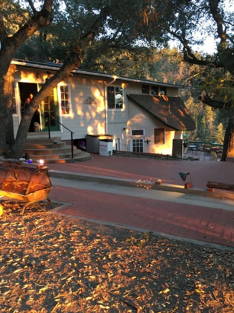 Front of house with huge brick patio
