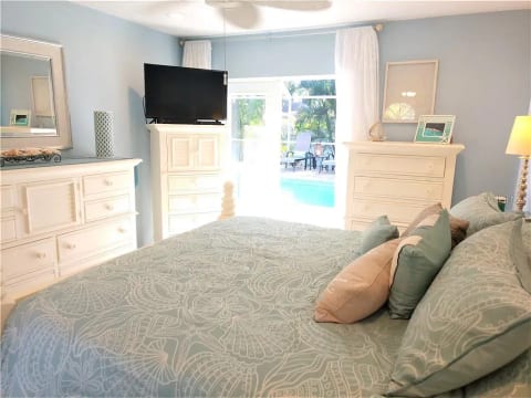 Master Bedroom, King bed with french doors to pool and screened in patio