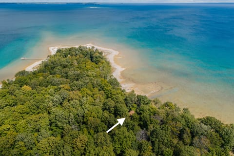 Aerial view of East Beach Cottage on the shores of Ingalls Bay, Omena