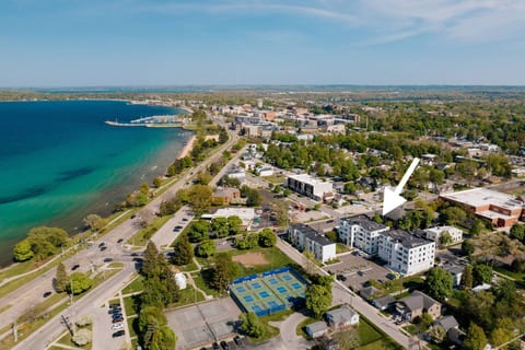Aerial view showing Jude’s Respite downtown near West Bay and parks