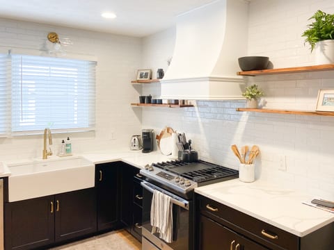 Fully equipped modern kitchen with stainless appliances