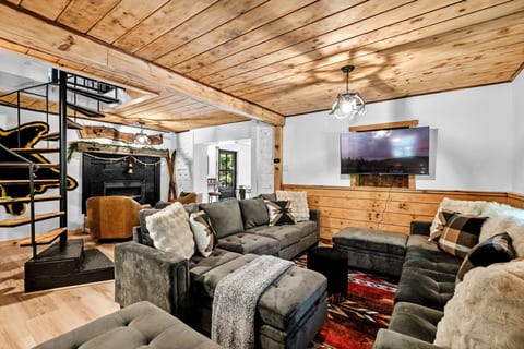 Relax on the double velvety couches while watching your favorite streaming services and relaxing by the heated fireplace.