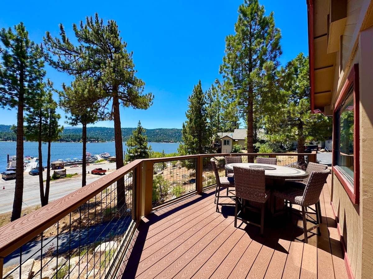 Counter height dining table with fire pit to enjoy meals and the amazing views.