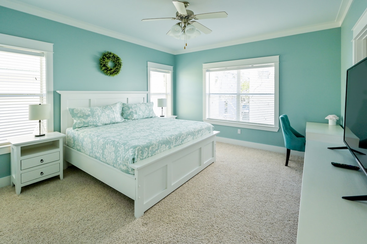 Upstairs master bedroom with custom made solid night stands, dresser, king bed with comfortable foam mattress