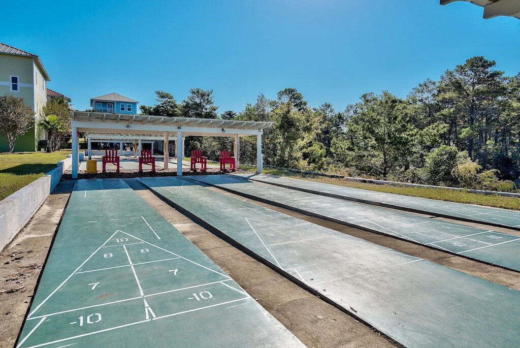 Enjoy a game of shuffle board with your family and friends at The Village at Blue Mountain Beach. 