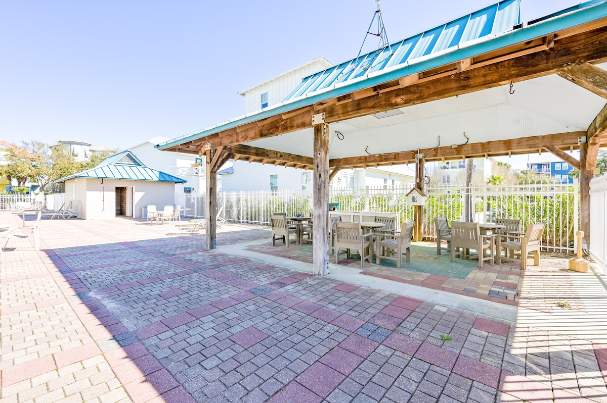Covered seating and restroom by the pool