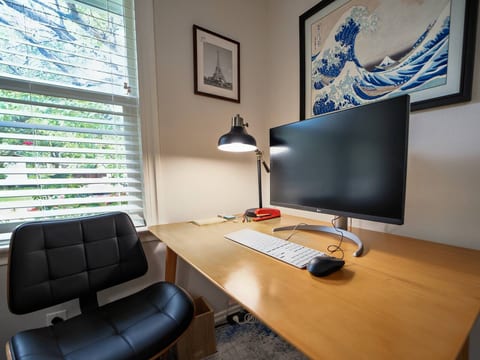 A comfortable chair and a non-reflective 4K display with a USB-C interface, driving a wired keyboard and mouse, allow you to plug in only one wire to your computer and get started.