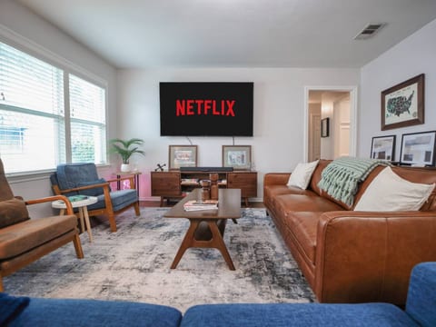 This quiet and relaxing living room is the perfect size for friends or family to put down the screens and engage, or if you want, the massive 75" 4K Smart TV with Sound Bar is perfect for that movie you have been wanting to watch.