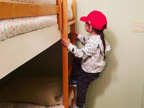 Inspector insuring bed linens and comforters are clean and ready for our guests.