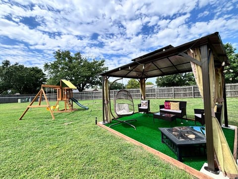 Place in West of Wichita - Duplex with Backyard Swing and 75" TV