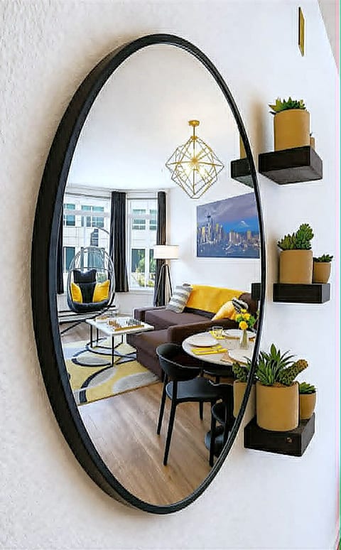Sunny, stylish lounge with bay windows, swing chair & chic accents